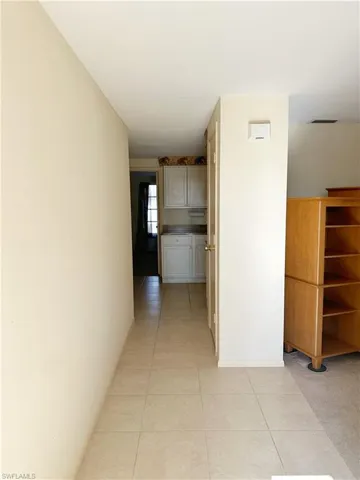 Front entry, Kitchen and Primary bedroom ahead, Living room to the right