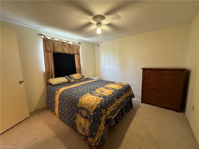 Bedroom 2 featuring carpet and ceiling fan