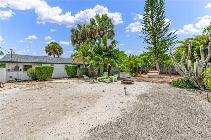 View of yard with an outdoor fire pit