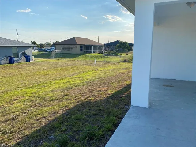 View of yard featuring fence