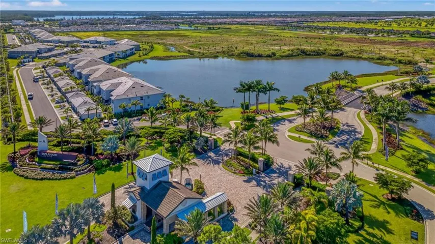 Aerial perspective of suburban area with a nearby body of water