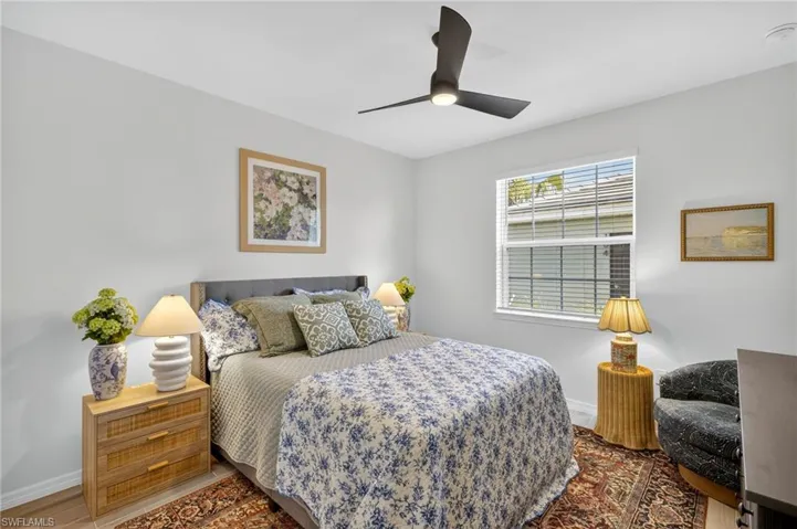 Bedroom featuring a ceiling fan and wood finished floors
