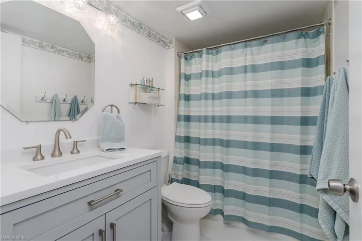 Full bathroom with tub shower and new vanity