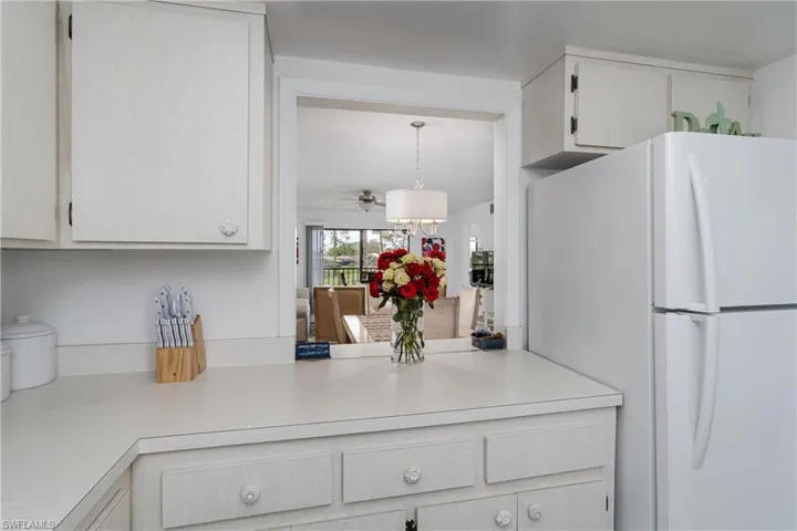 Kitchen featuring pass thru to dining area