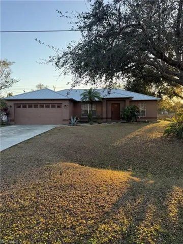 Single story home with a garage