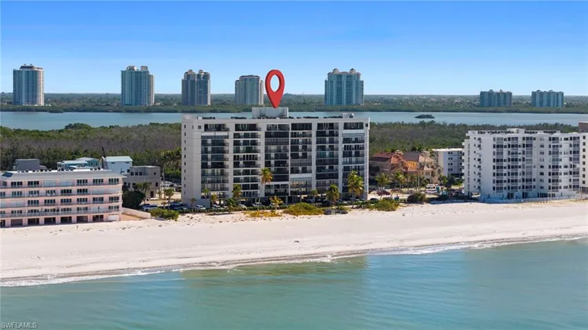 View of urban area featuring expansive beach