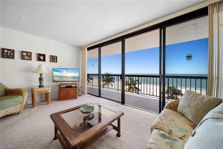 Living room with carpet and expansive windows