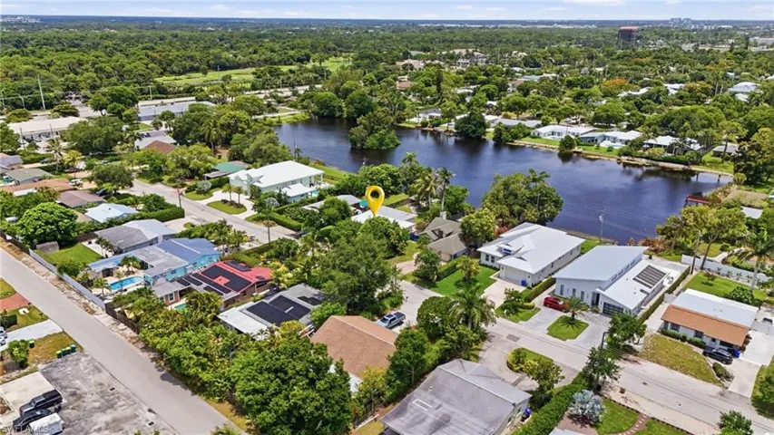 Aerial perspective showcasing a residential area with a prominent body of water