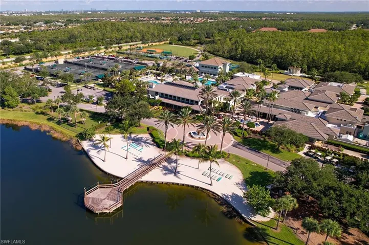 Aerial view of community town center location with nearby suburban area and a nearby body of water