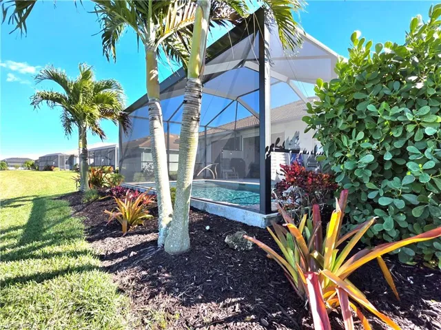 View of yard featuring an outdoor pool, and a lanai
