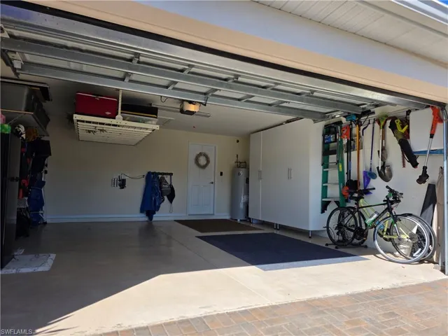 Garage featuring electric water heater
