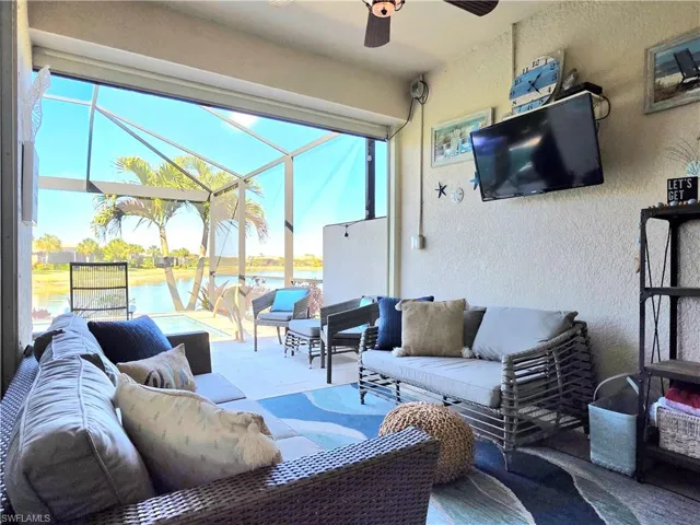 View of patio featuring outdoor furniture, a lanai, and ceiling fan