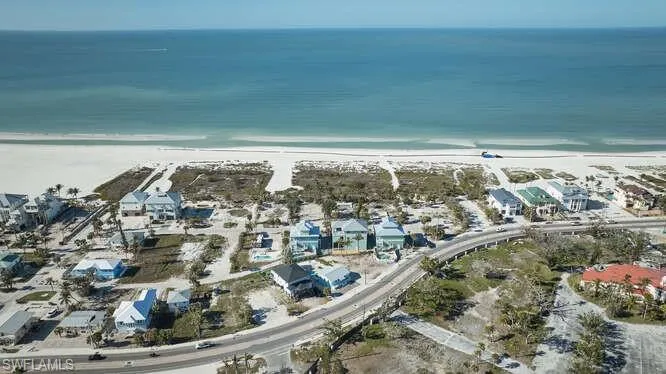 Aerial view with a beach view and a water view