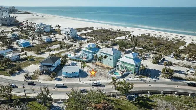 Bird's eye view featuring a beach view and a water view
