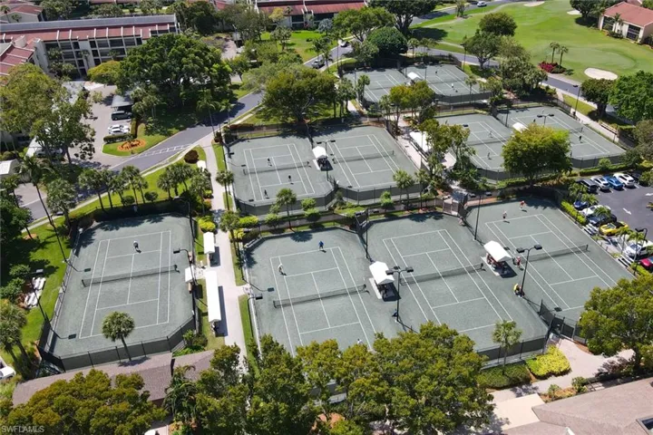 Aerial view with view of golf course and a residential view