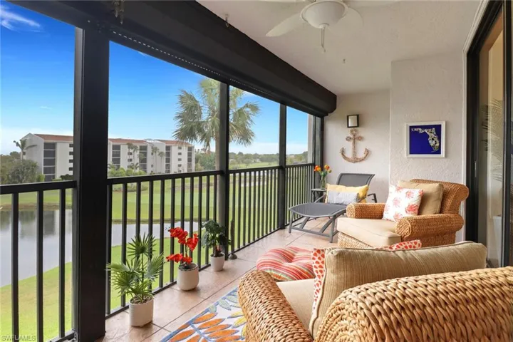 Sunroom with a ceiling fan