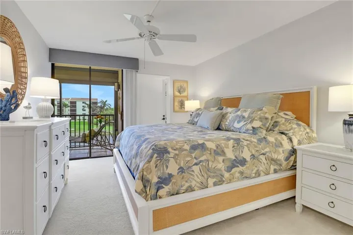 Bedroom with ceiling fan, access to outside, and light colored carpet