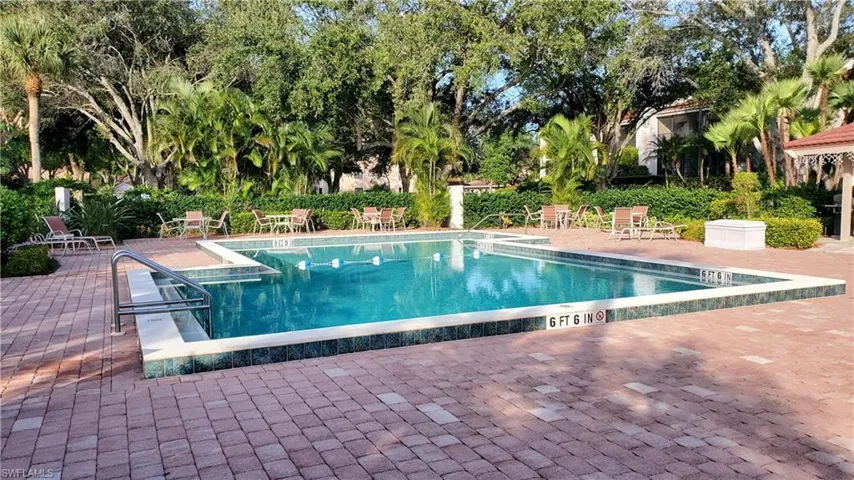 Pool featuring a patio area and fence