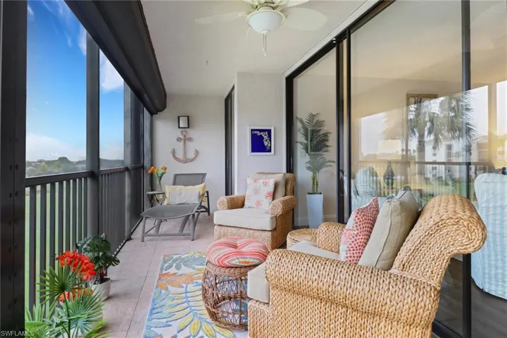 Sunroom featuring ceiling fan