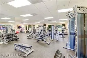 Gym with a paneled ceiling