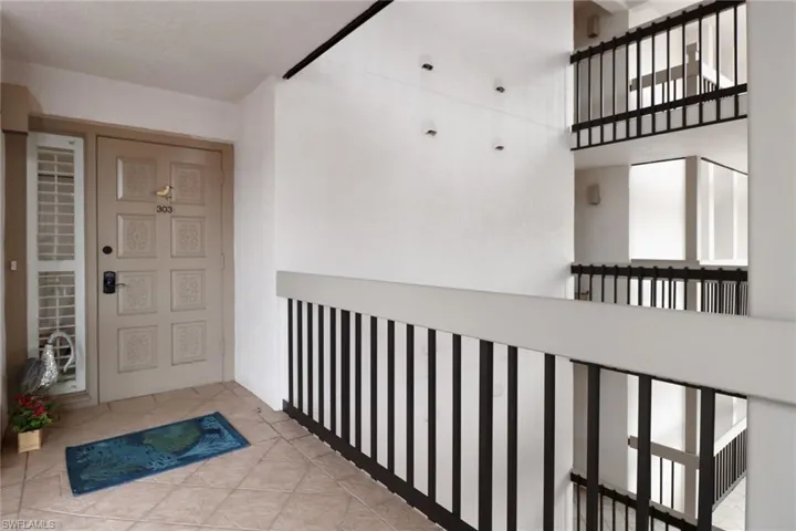 View of exterior entry featuring a balcony