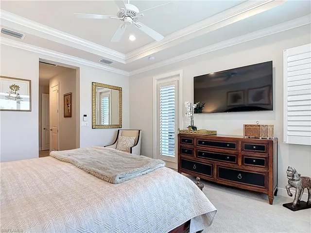 Carpeted bedroom featuring recessed lighting, ceiling fan, crown molding