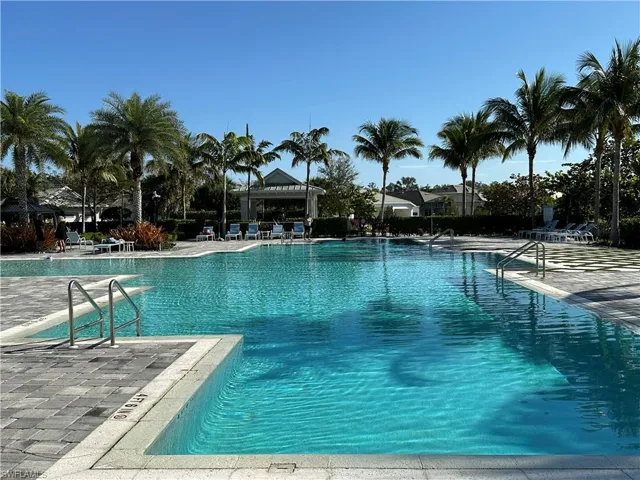 Community pool featuring a patio