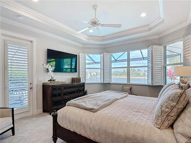 Bedroom featuring recessed lighting, crown molding, all to wall carpet, and coffered ceiling.