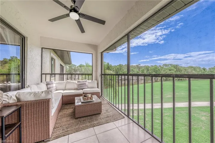Sunroom featuring ceiling fan