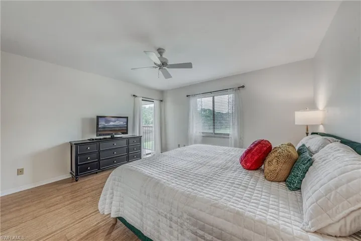 Bedroom featuring ceiling fan and light hardwood / wood-style flooring