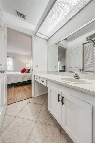 Bathroom featuring hardwood / wood-style flooring and vanity