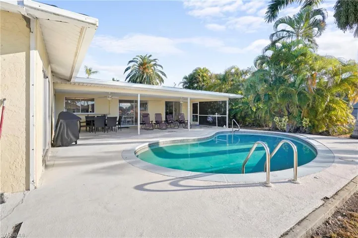 View from the water front dock to the pool and covered lania.