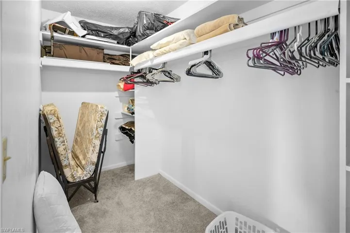 Primary bedroom suite features a large walk in closet.