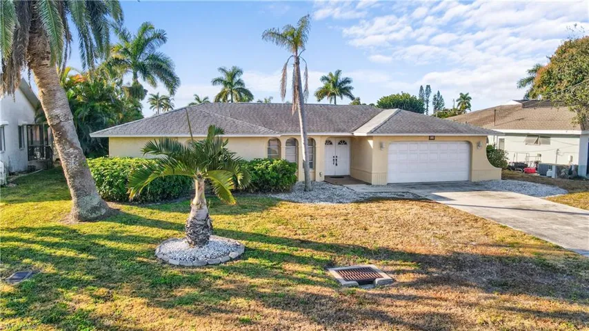 Ranch-style house double door entry, newer roof. concerte block construction with stucco exterior finish, concrete driveway, a oversized 2 car garage and new roof.