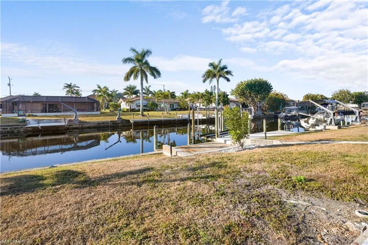 Gulf access canal with boat dock and boat lift.