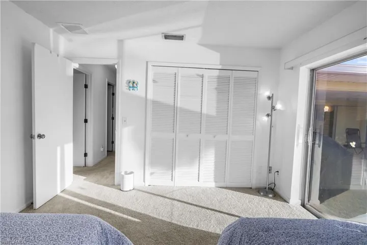 Guest bedroom opens to pool has large closet.