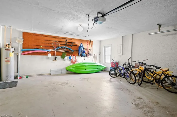 Spacious attached two-car garage with side door entrance. Home comes with sporting equipment, including Kayaks and bikes.