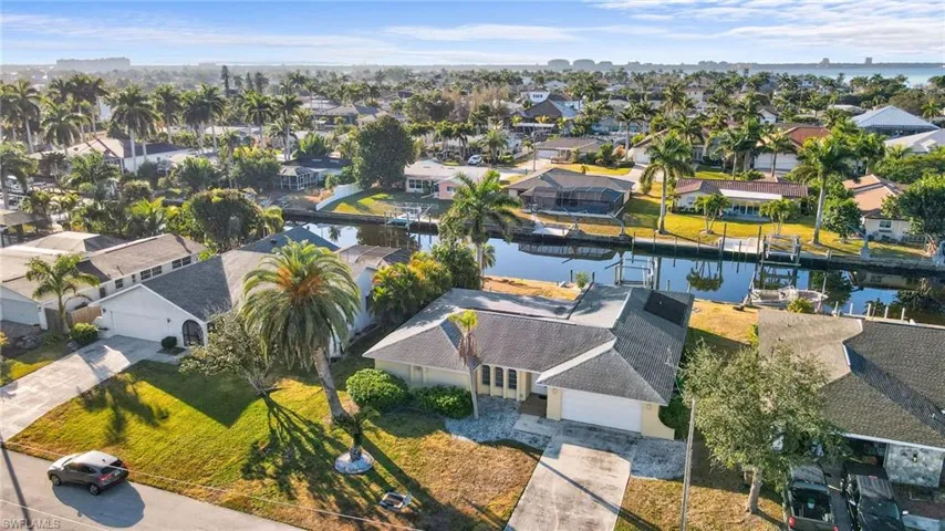 Areial view of the front of the home, direct access canal and close proximity to the Caloosahatchee River.
