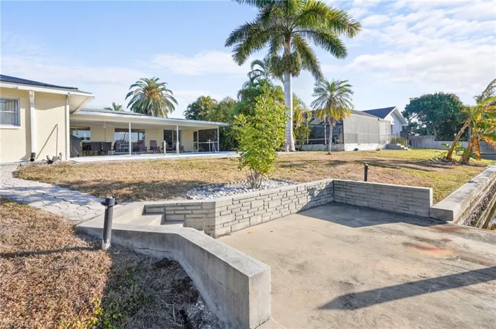View of backyard pool area from the boat dock.