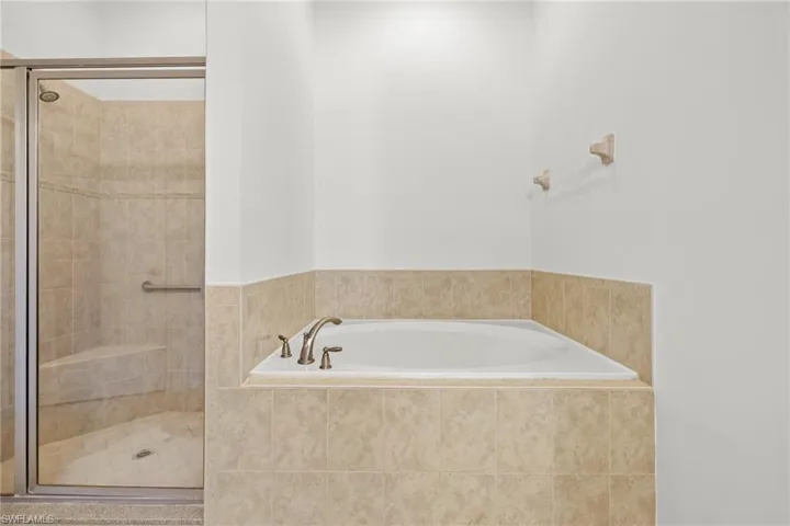 Bathroom with tub and walk in shower
