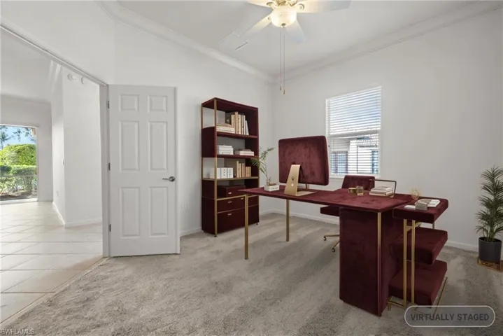 Office with light tile patterned floors, baseboards, light colored carpet, and ornamental molding