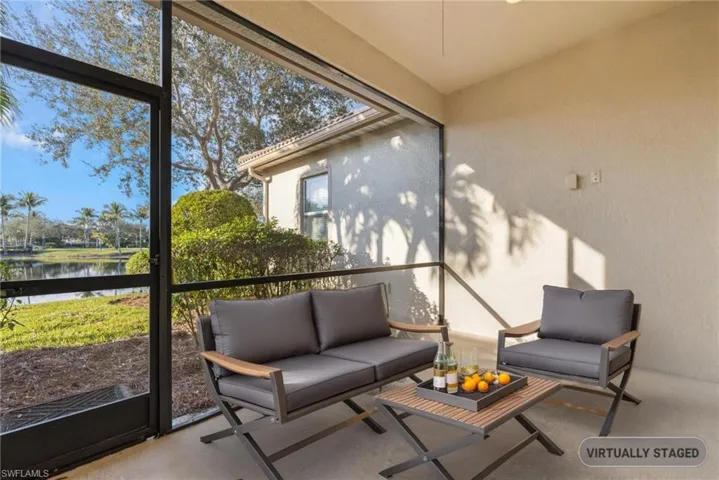 Sunroom / solarium with a wealth of natural light and a water view