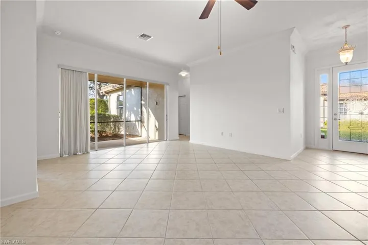 Living room with tile and access to the screened-in lanai