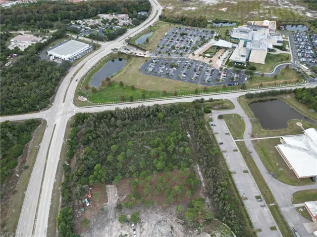 Aerial overview of property's location featuring a nearby body of water
