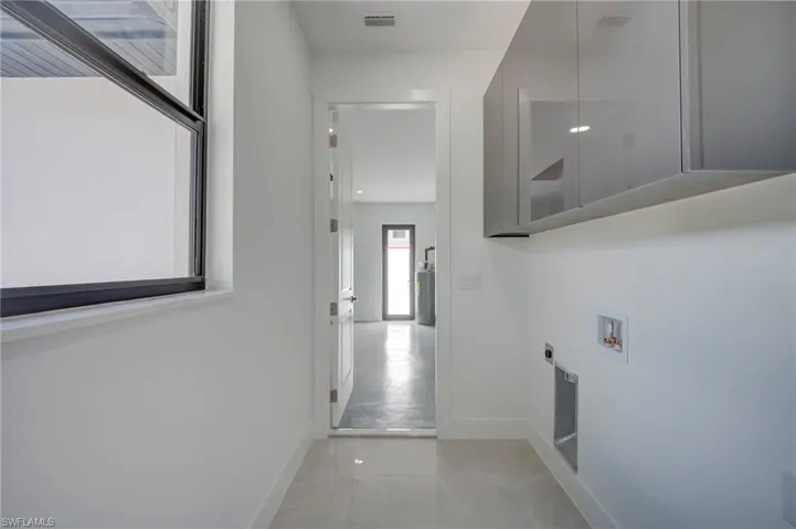 Laundry area featuring hookup for a washing machine and electric dryer hookup