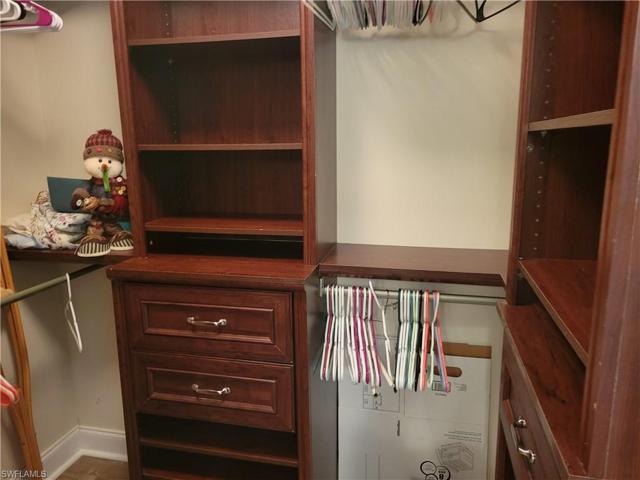Master walk-in closet with built-in drawers and shelving