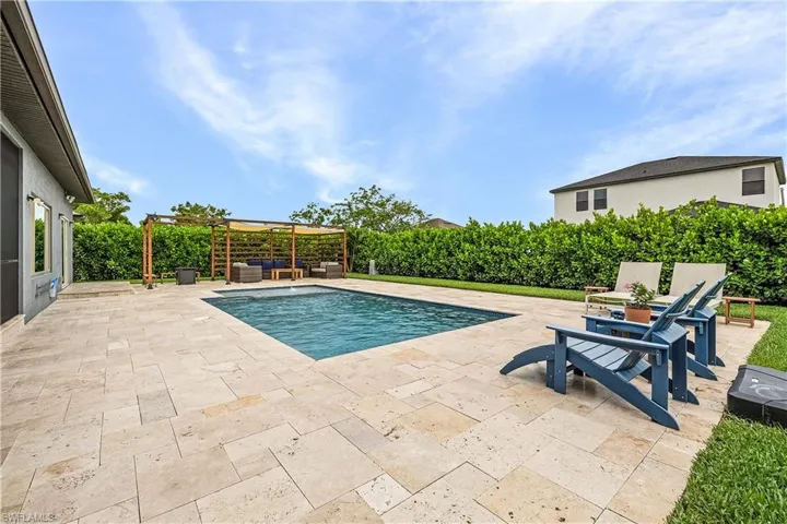 View of pool with a patio area and pool deck