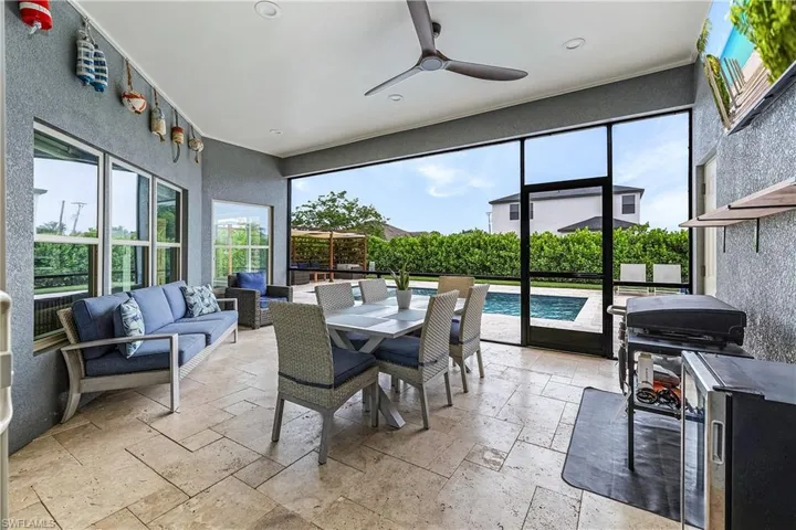 Patio with tile flooring, a ceiling fan, and recessed lighting