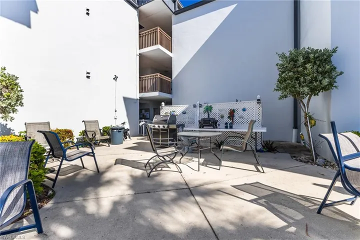 View of patio with grilling area and outdoor dining space