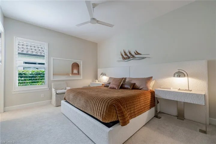 Bedroom with carpet flooring and ceiling fan